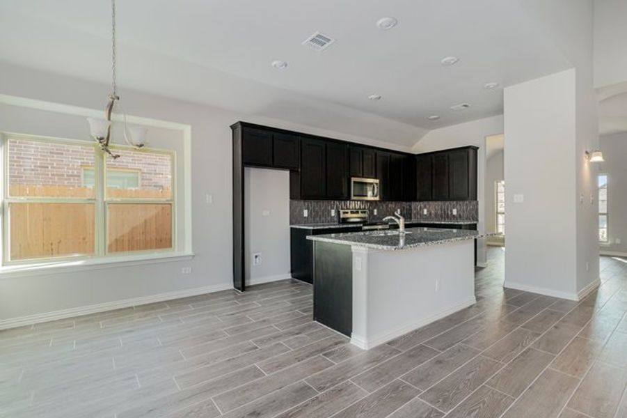 Furnished interior view inside a new home in Mustang Place II, Heartland (Image 6).