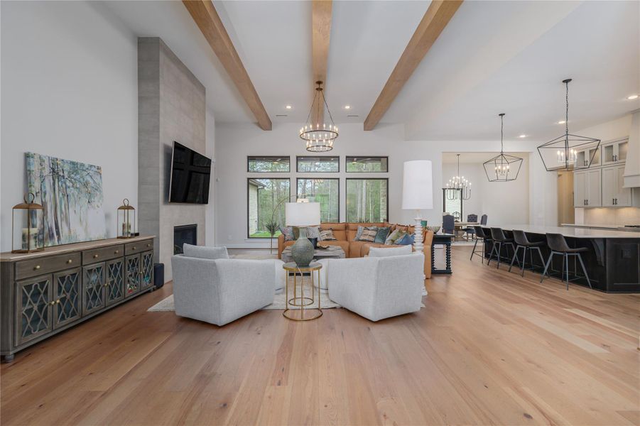 The effortless sophistication is present with a very natural organic look.  The imposing feature gas log fireplace is dressed in subtle grey tile and commands attention within the living space.