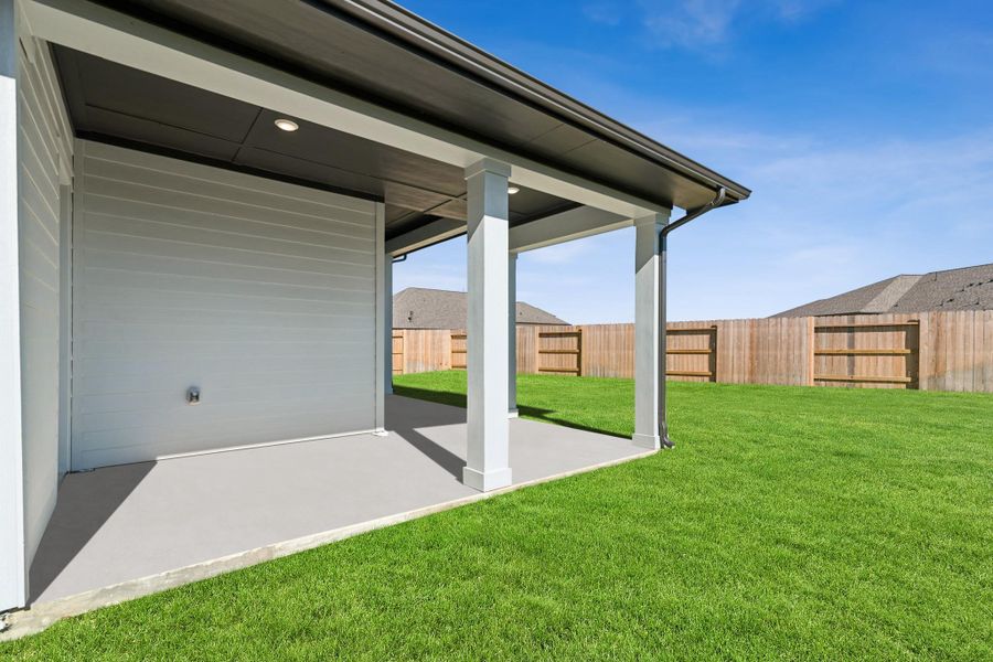 Exterior details and patio area of a home in ARTAVIA 50' Homesites, Conroe (Image 25).