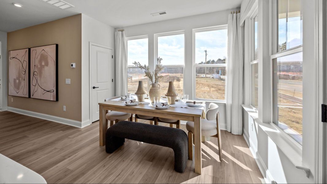 The Rochester Plan by DRB homes cozy dining area with multiple points of natural light in Charlotte, NC.