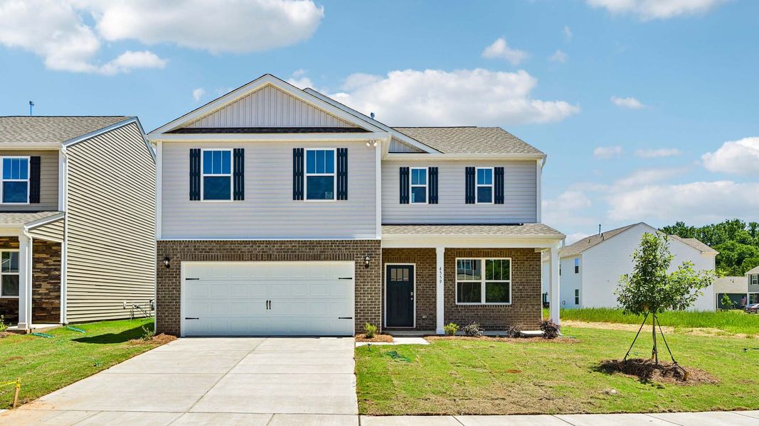 Front exterior of a new home in Clark Creek Landing, Lincolnton, NC, highlighting curb appeal (Image 1). Front exterior of a new home in Clark Creek Landing, Lincolnton, NC, highlighting curb appeal (Image 1).