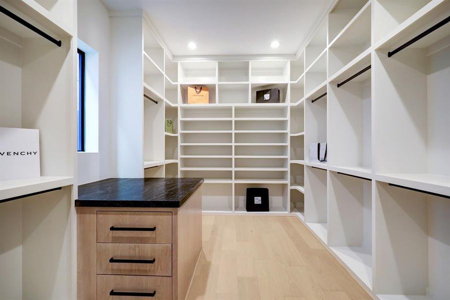 Primary closet offers space maximization and is pre wired for LED lighting