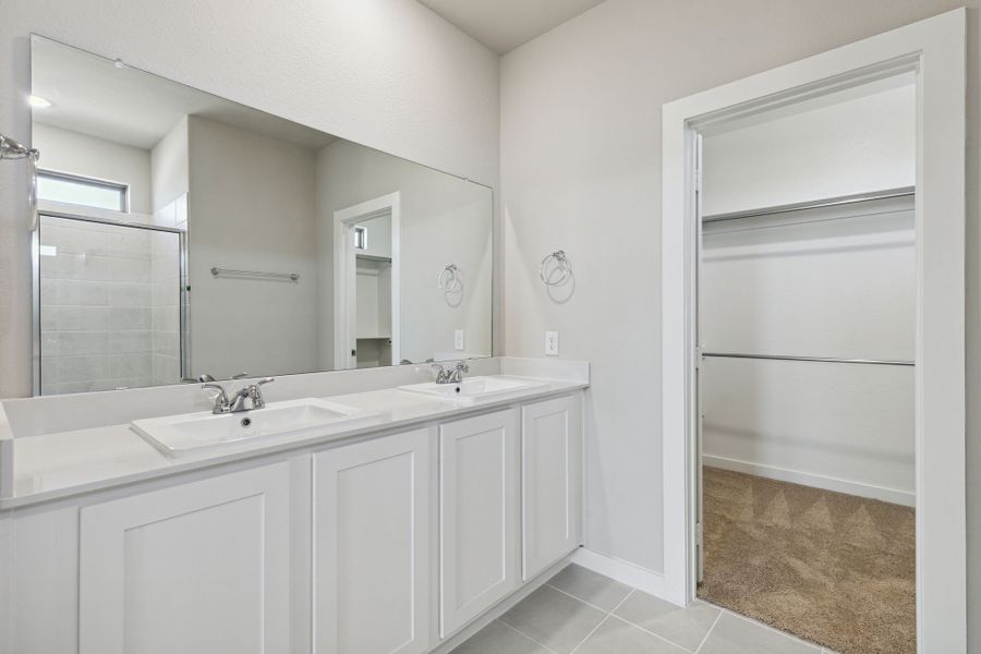 Primary bathroom in the Oak home plan by Trophy Signature Homes – REPRESENTATIVE PHOTO