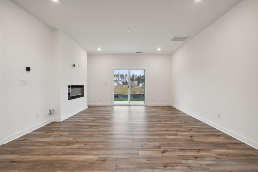 A room with a wood floor and a wood floor. A room with a wood floor and a wood floor.