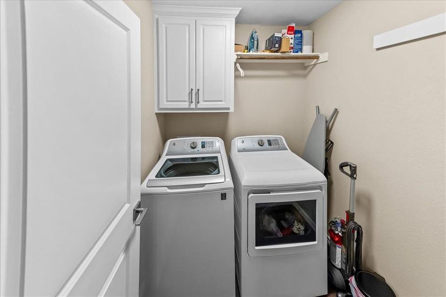Laundry area with cabinet space