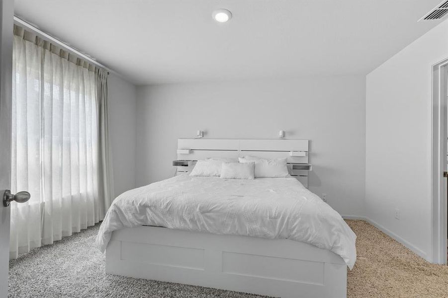 Bedroom featuring carpet and recessed lighting