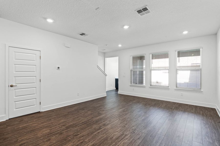 Spacious, unfurnished interior of a new home in Harvest at Ovation - Townhomes, Winter Garden (Image 12).