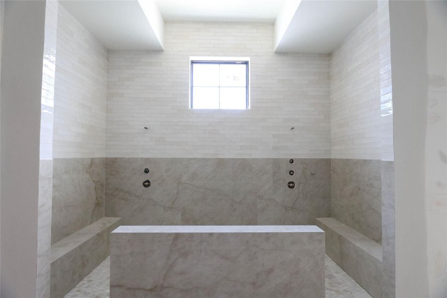 Extra Large walk-in Shower w/ dual fixtures & benches.