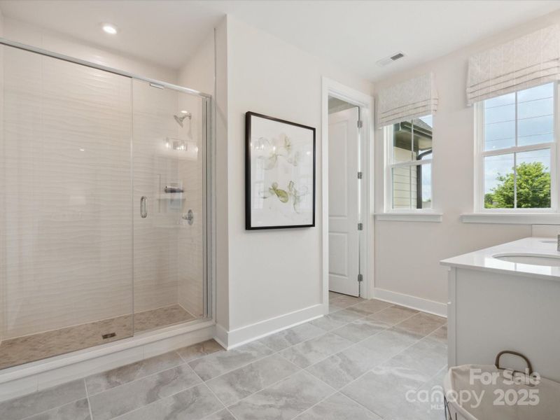 Huge en suite bath that is more like an at home spa. *Model Photos | Actual finishes, structural selections, and orientation may vary.