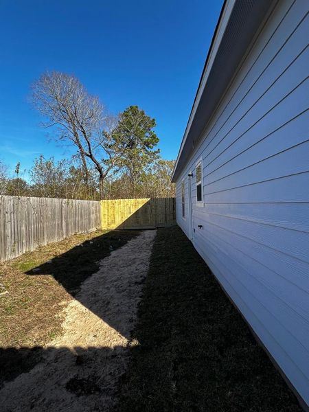 Exterior details and patio area of a home in , Conroe (Image 3).
