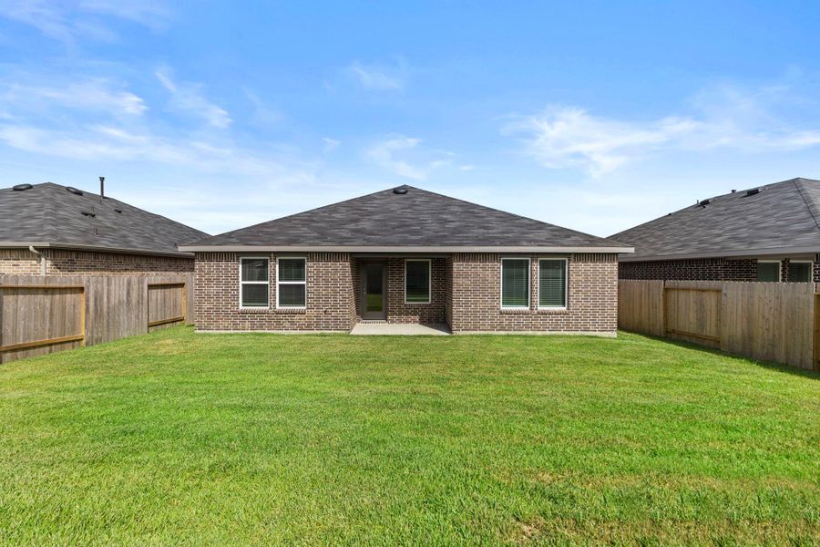 Exterior details and patio area of a home in Harrington Trails at The Canopies, Splendora (Image 4).
