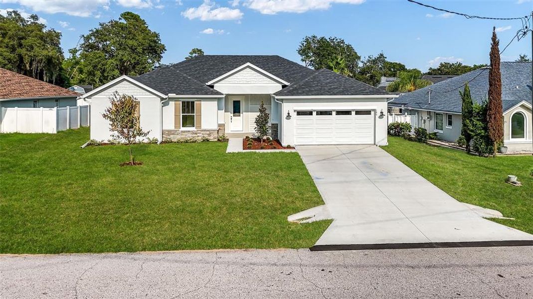 Front exterior of a new home in , Palm Coast, FL, highlighting curb appeal (Image 24).