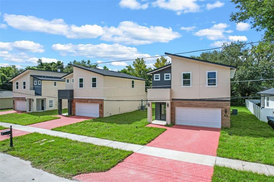 Front exterior of a new home in , Orlando, FL, highlighting curb appeal (Image 28). Front exterior of a new home in , Orlando, FL, highlighting curb appeal (Image 28).