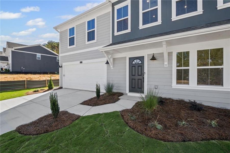 Front exterior of a new home in Sage Woods, Dallas, GA, highlighting curb appeal (Image 20).
