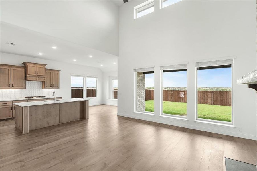 The Drama created by the second level ceiling of this Great Room is so Inviting!