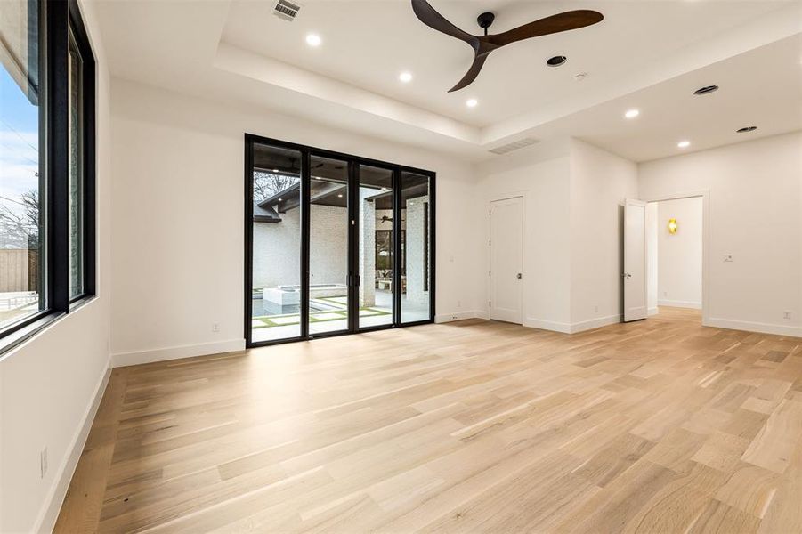 Generous in size and thoughtfully placed, the main floor bedroom/game room offers flexible space for media, games, or casual seating