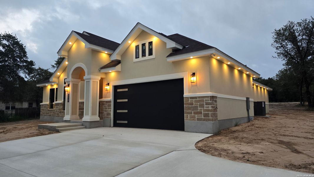 Front exterior of a new home in , Natalia, TX, highlighting curb appeal (Image 24).