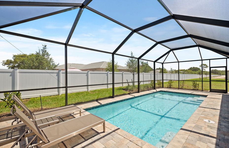 Exterior details and patio area of a home in Whispering Lakes, Lehigh Acres (Image 4).