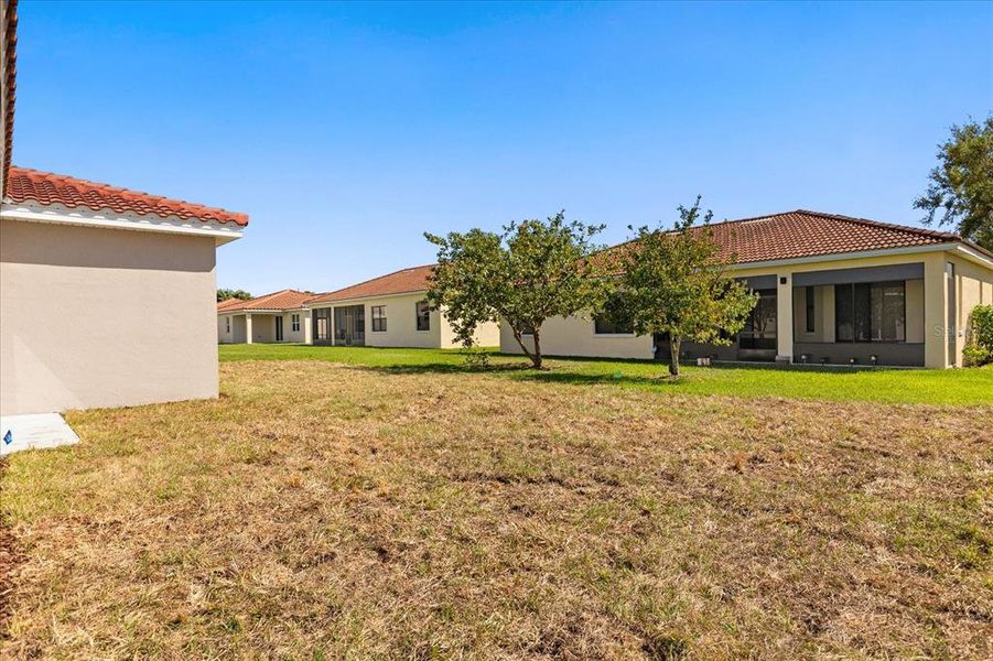 Front exterior of a new home in , Kissimmee, FL, highlighting curb appeal (Image 14).