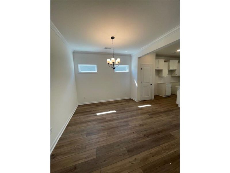 This inviting dining area features elegant crown m