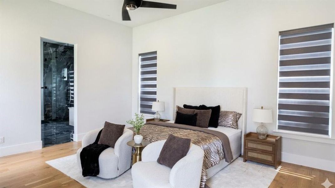 Open concept room featuring light wood-finish flooring, a contemporary ceiling fan, and large windows with privacy blinds