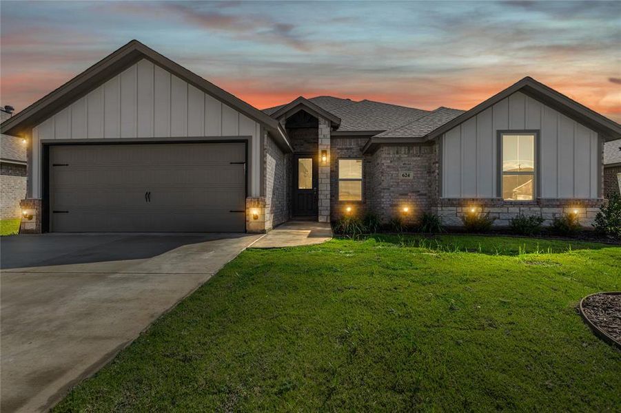 Front exterior of a new home in , Springtown, TX, highlighting curb appeal (Image 25).