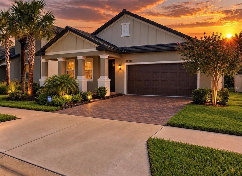 Front exterior of a new home in Angeline Active Adult, Land O' Lakes, FL, highlighting curb appeal (Image 25).