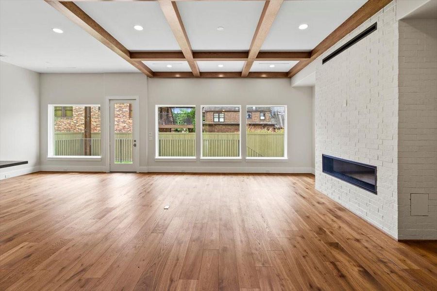Oak beams and 60 inch natural gas fire place in the family room