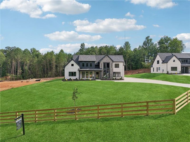 Front exterior of a new home in , Braselton, GA, highlighting curb appeal (Image 29).