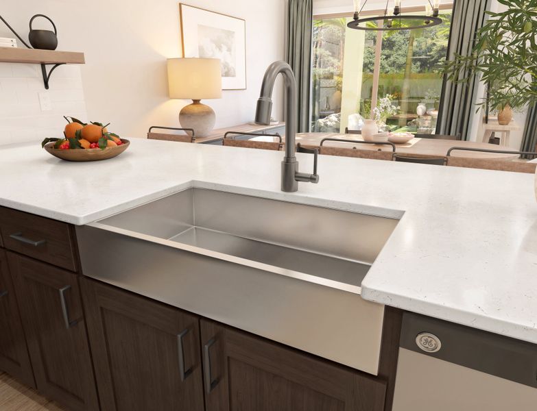 Stainless steel apron-front sink and chrome faucet