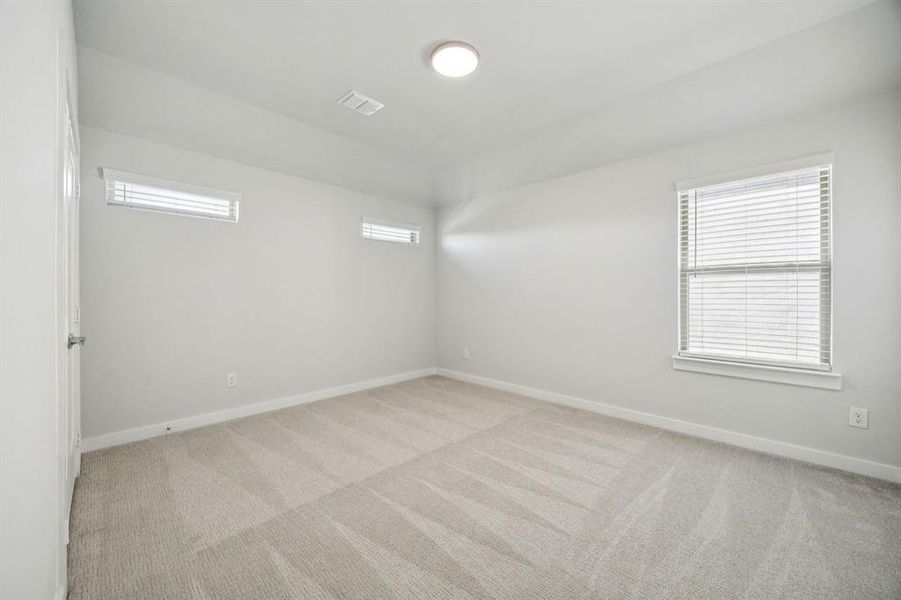 Bedroom in the Wimbledon home plan by Trophy Signature Homes – REPRESENTATIVE PHOTO Bedroom in the Wimbledon home plan by Trophy Signature Homes – REPRESENTATIVE PHOTO