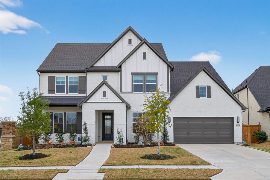 Front exterior of a new home in Dunham Pointe 65' Homesites, Cypress, TX, highlighting curb appeal (Image 2). Front exterior of a new home in Dunham Pointe 65' Homesites, Cypress, TX, highlighting curb appeal (Image 2).