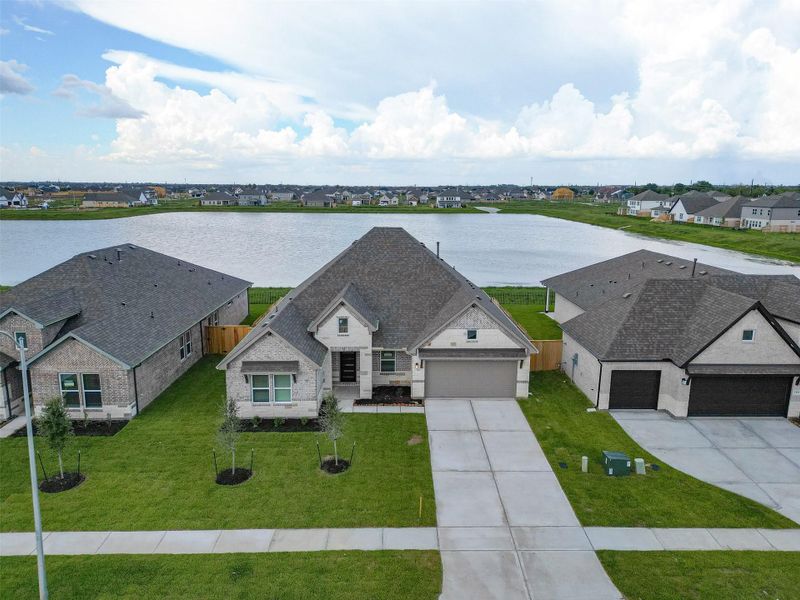 Front exterior of a new home in Foxtail Palms, Manvel, TX, highlighting curb appeal (Image 25).