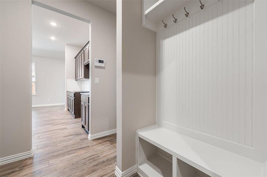 Mudroom with light wood-style floors and recessed lighting Mudroom with light wood-style floors and recessed lighting