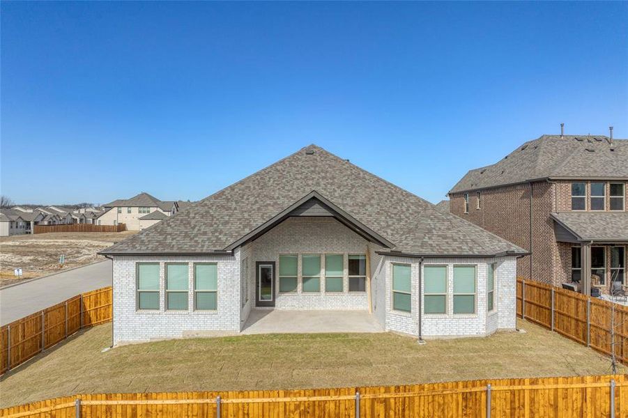 Exterior details and patio area of a home in Estates At Baker Park, Sherman (Image 21).