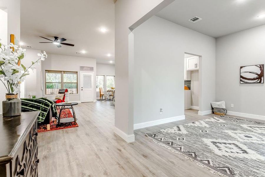 Entryway featuring ceiling fan and light hardwood / wood-style floors