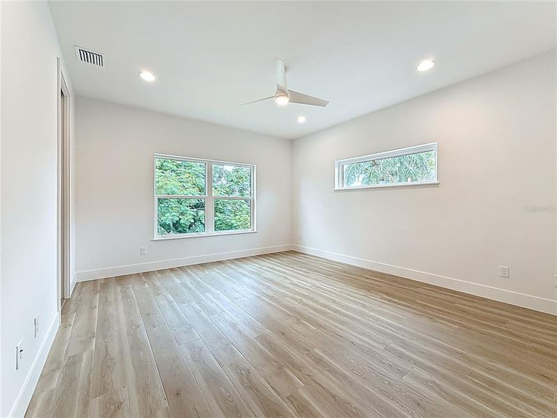 Elegant Primary Bedroom upstairs featuring a sleek en suite bath and abundant natural light. Elegant Primary Bedroom upstairs featuring a sleek en suite bath and abundant natural light.