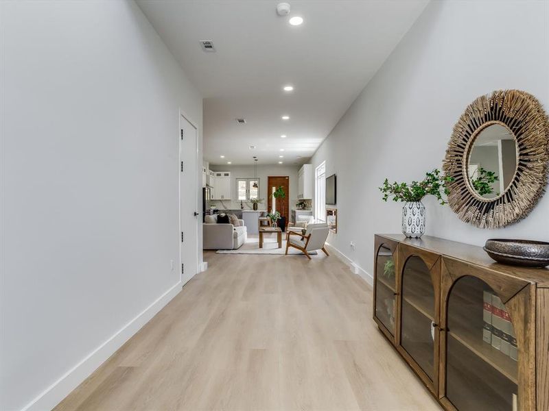 Entryway featuring light wood-finish flooring, recessed ceiling lighting, and crisp white walls Entryway featuring light wood-finish flooring, recessed ceiling lighting, and crisp white walls