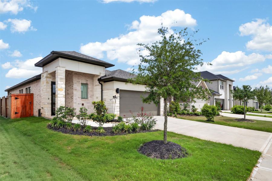 Front exterior of a new home in Jordan Ranch, Fulshear, TX, highlighting curb appeal (Image 26).