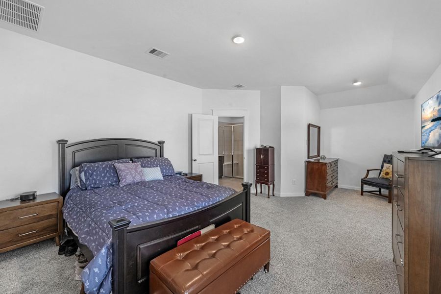 The primary bedroom is generously sized, creating a tranquil and spacious retreat that offers ample room for relaxation.