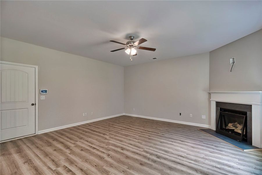This inviting living space features warm flooring