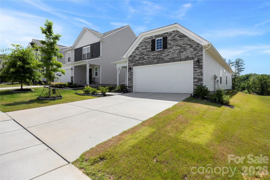 Front exterior of a new home in Legacy Ridge, Catawba, NC, highlighting curb appeal (Image 22). Front exterior of a new home in Legacy Ridge, Catawba, NC, highlighting curb appeal (Image 22).