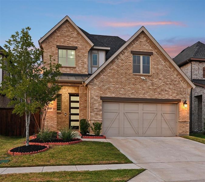 Front exterior of a new home in , Plano, TX, highlighting curb appeal (Image 1). Front exterior of a new home in , Plano, TX, highlighting curb appeal (Image 1).