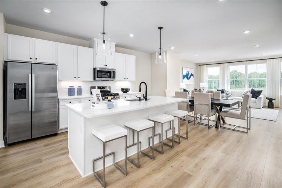 Representative furnished interior of a home built from the Schuman by Ryan Homes in Stowe Branch Townhomes, Charlotte (Image 2).