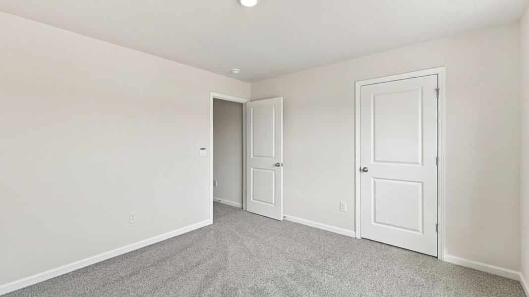 Spacious, unfurnished interior of a new home in Bentley Park, Greenwood (Image 26).