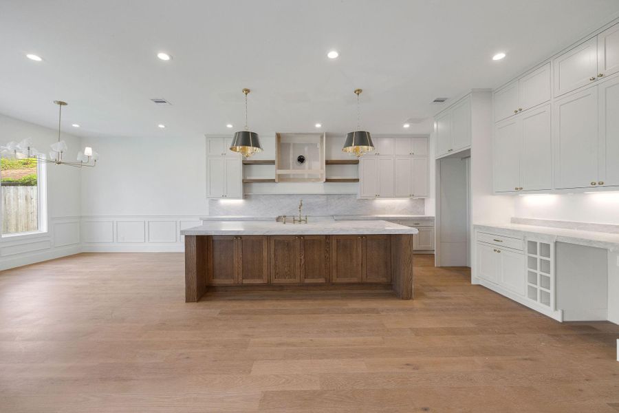 A stunning kitchen anchors the home as the true showpiece. A stunning kitchen anchors the home as the true showpiece.