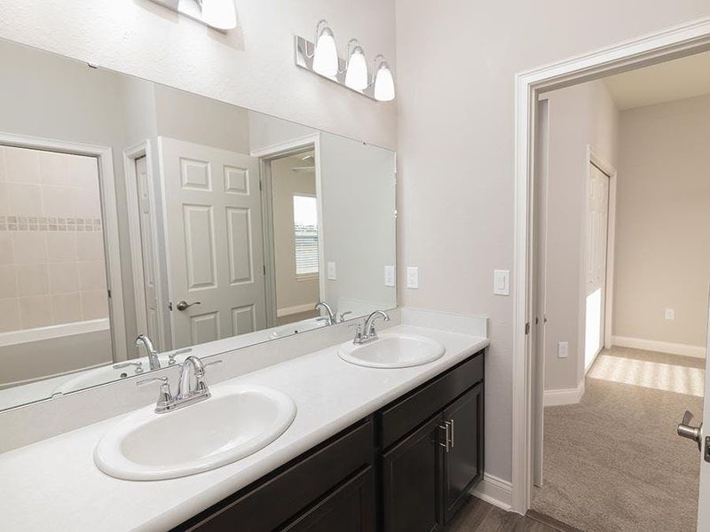 Bedrooms 2 and 3 share a Jack-and-Jill bath - Savannah by Highland Homes