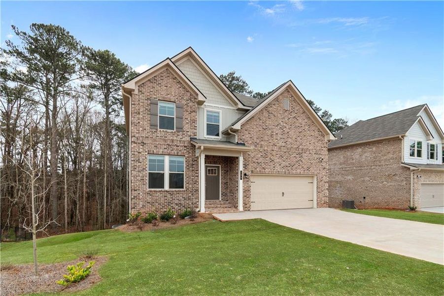 Front exterior of a new home in Cedar Grove Commons, Conley, GA, highlighting curb appeal (Image 2). Front exterior of a new home in Cedar Grove Commons, Conley, GA, highlighting curb appeal (Image 2).