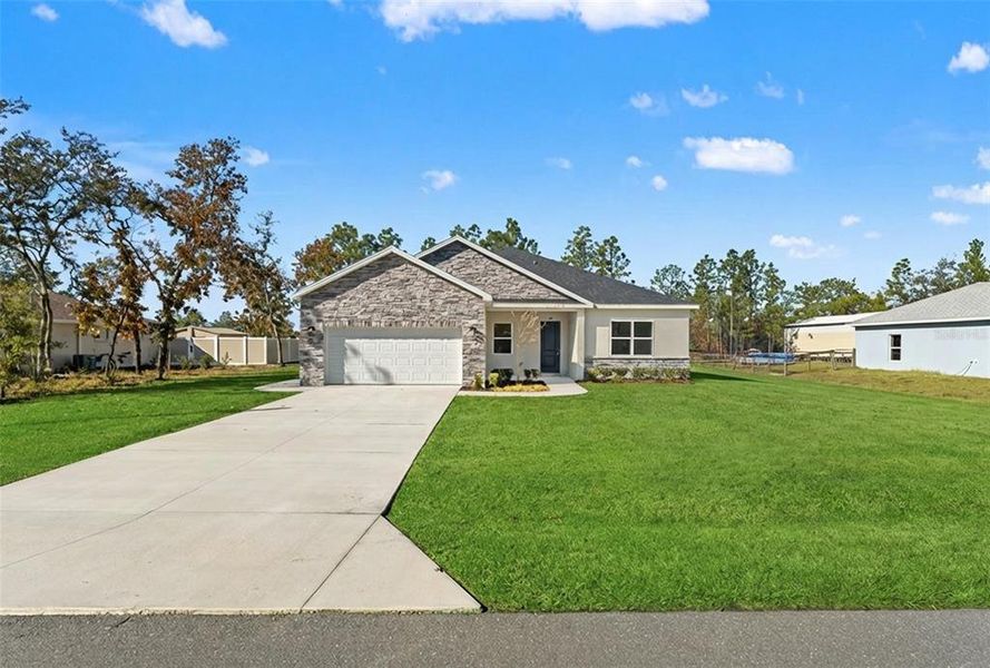 Front exterior of a new home in , Weeki Wachee, FL, highlighting curb appeal (Image 28).