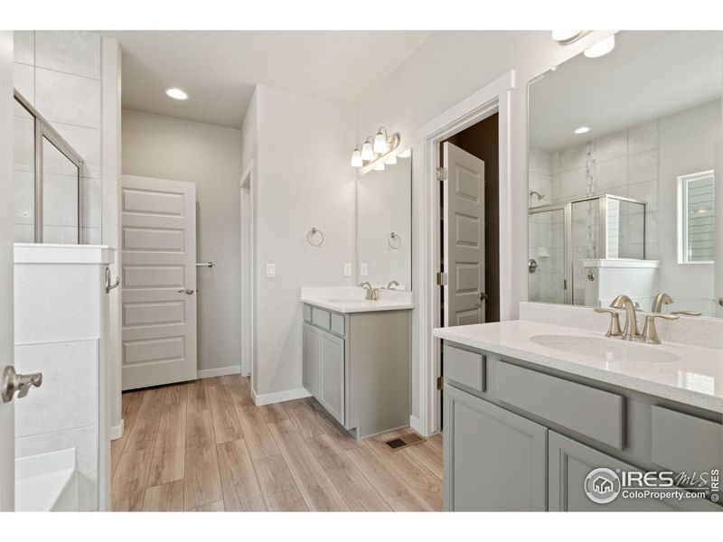 Primary Bath has separate commode closet and large linen closet